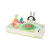 Children's musical toy with a rabbit character and various colorful elements on a white background
