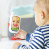 Child interacting with a digital mirror showing a cartoon face.